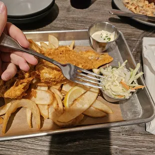 Fish and chips with the fork as a size comparison for the $5 tin of coleslaw