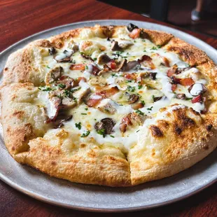 a pizza on a plate on a table