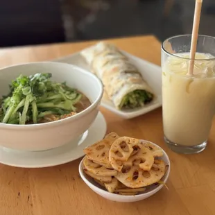 Side of diced lotis root, Dan Dan noodles, beef roll, and ice jasmine green milk tea.