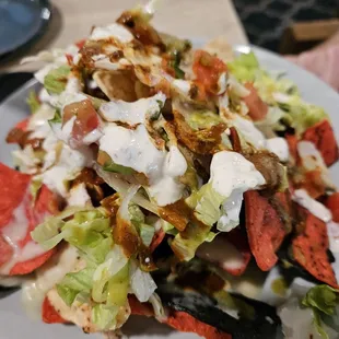 Half order of nachos with chicken. Could have had more chicken. Recommend to layer the chips and toppings for better ratio.