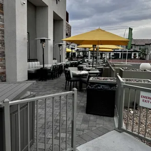 Patio dining in front of building.