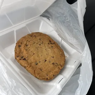 a cookie in a plastic container