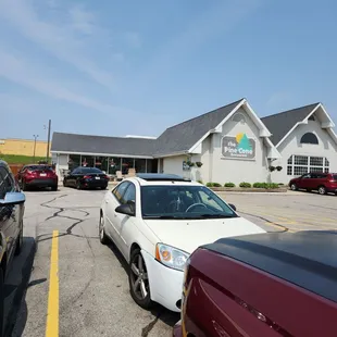 parking lot with cars parked in front