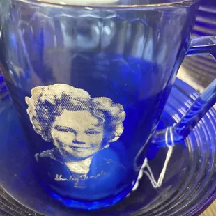 A Shirley Temple blue cobalt glass creamer.