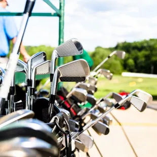 golf clubs lined up in a row