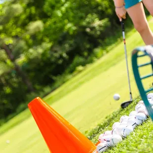 a woman playing golf