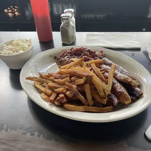 Pulled pork, jalapeño cheddar sausage links, fresh cut, fries, and coleslaw