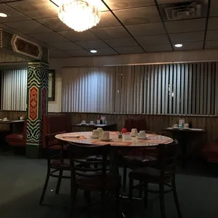 a dining room with a table and chairs