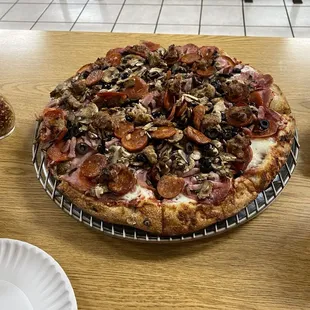 All meat with mushrooms and olives, extra sauce and extra cheese...oh how yummy!!!!