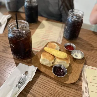 a woman sitting at a table with food