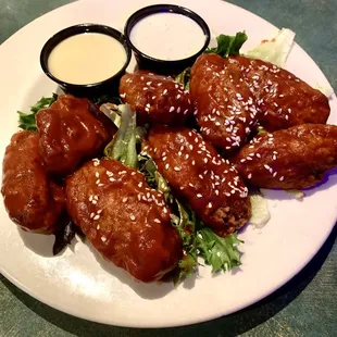 Spicy BBQ wings. These are battered and fried and delicious.