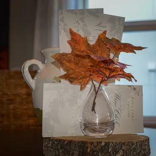 a maple leaf in a vase