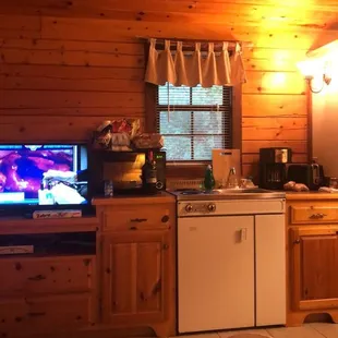Mini fridge, 2 burner stove, tv, DVD player, coffee pot and coffee,