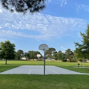 Basketball court with a huge field behind it