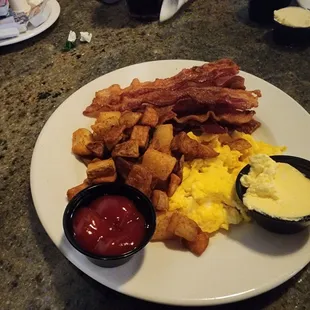 Diced potatoes, scrambled eggs and bacon.