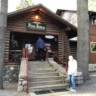 Great Northwoods atmosphere with gorgeous lake views from the log cabin entrance.