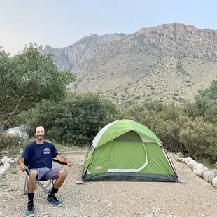 Relaxing and appreciating the backdrop of desert and mountains.