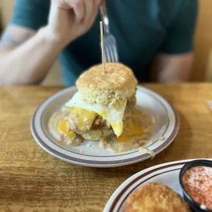 a man eating a breakfast sandwich