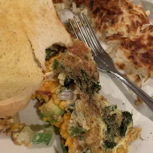 Build your own omelette, 3 eggs, spinach, bacon, onion, green bell pepper, tomato, cheddar cheese, avocado