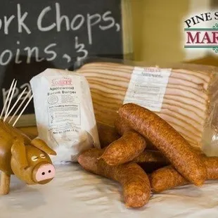 sausages, bread sticks, and a pig