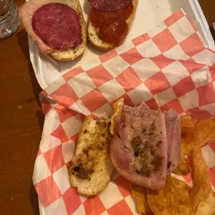 a tray with a sandwich and chips