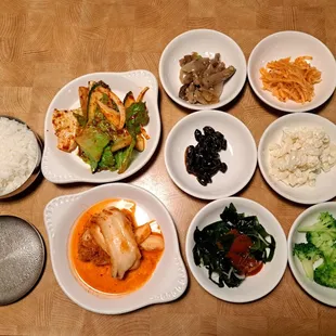 Banchan: rice, spicy romaine &amp; cucumber, eggplant &amp; onion, spicy radish salad, Korean black beans, macaroni salad, kimchi, seaweed, broccoli