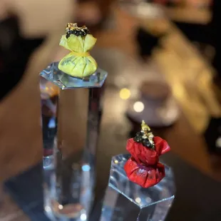 two glass vases on a table