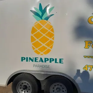 a trailer with a pineapple on the side