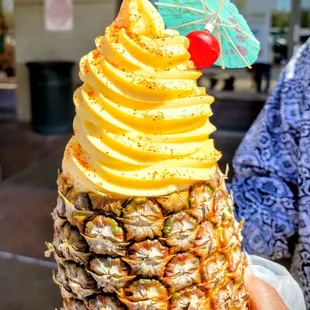 Pineapple smoothie with dole whip on top and tajin sprinkles