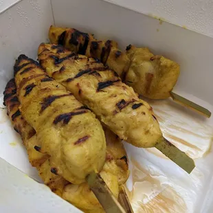 Pineapple Thai Cuisine - chicken satay to go ($8.95 for 3 large pieces) (partially consumed) 2/2023