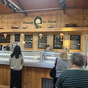 Inside the business with menu on the board.