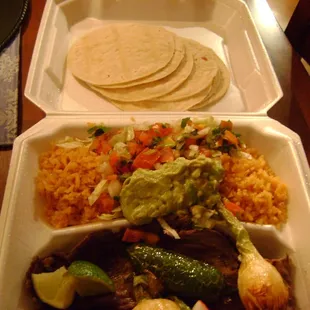 a meal in a styrofoam container