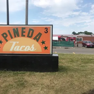a sign for pineda tacos