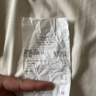 a person pointing at a receipt