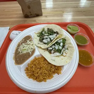 Combo #9 - two tacos with rice, beans. Steak &amp; onions and barbacoa.