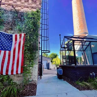 american flag on sidewalk