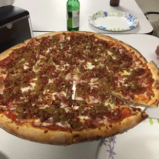 20" pizza loaded with toppings.