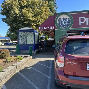 a car parked in front of the pub