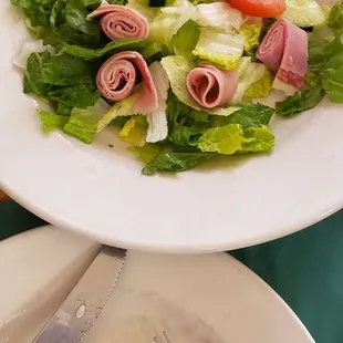 a plate of salad and a fork