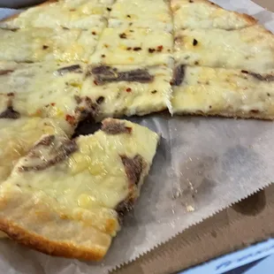 White Pizza half with anchovies.