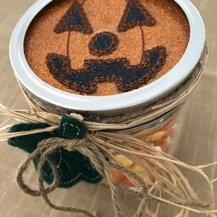 Cute pumpkin jar filled with candy corn. So cute. I will make one for every holiday-like National Coffee Day!