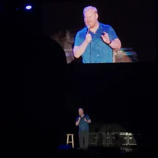 a man speaking on stage