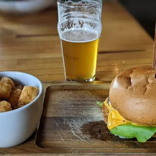 The house burger with a side of tots and an IPA