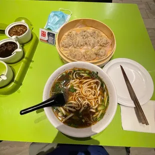 Beef noodle and flat soup dumplings.