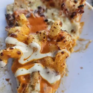 Mac Daddy Pizza - queso saice, mac and cheese, grilled chicken, bacon, ranch and buffalo sauce drizzle.
