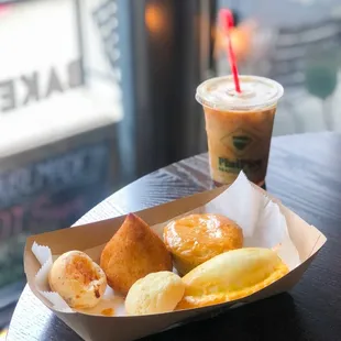 cortado coffe. left to right: [top] pão de queijo, coxinha, empada [bottom] empanada