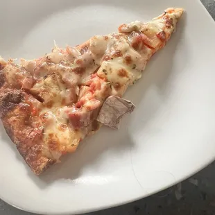 Hawaiian pizza. Notice the bandaid that came with it. I called and the manager told me I was lying. Well there it is. Gross