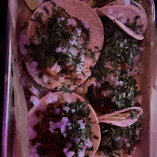 a tray of tacos on a table