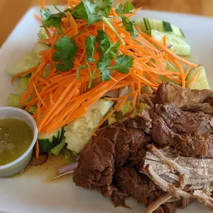 Braised Pork and Salad served with spicy green sauce