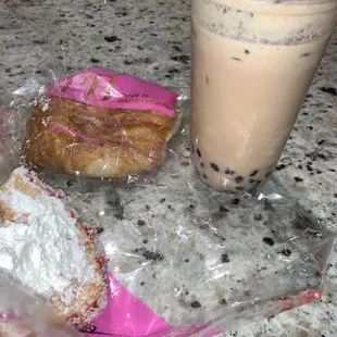 Coconut milk tea with tapioca, taro almond bun, strawberry buttercream bun.